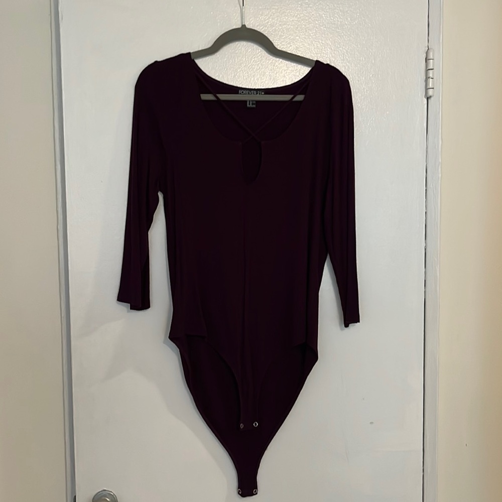 Purple body suit.